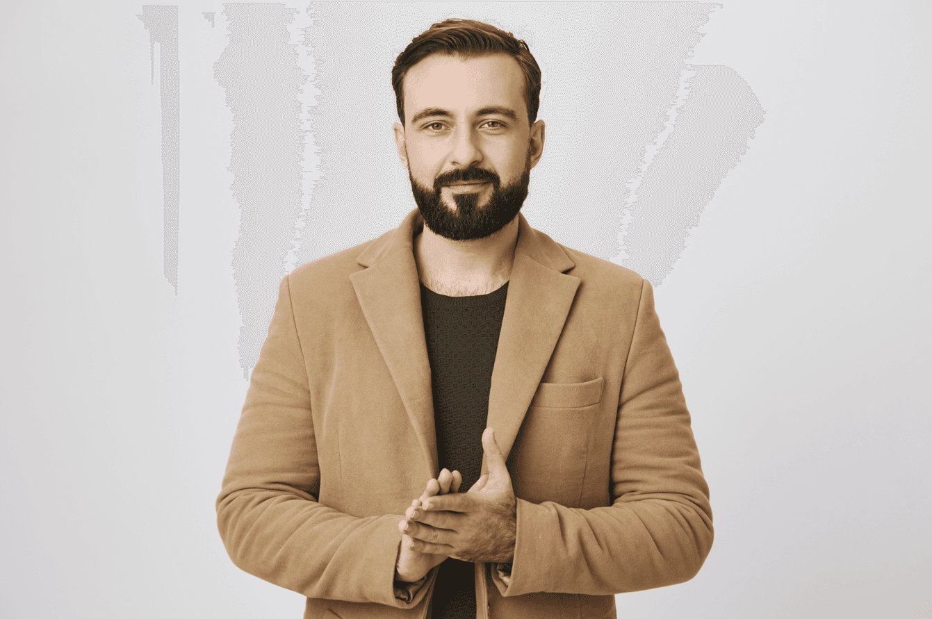 Handsome bearded businessman rubbing hands, having deal