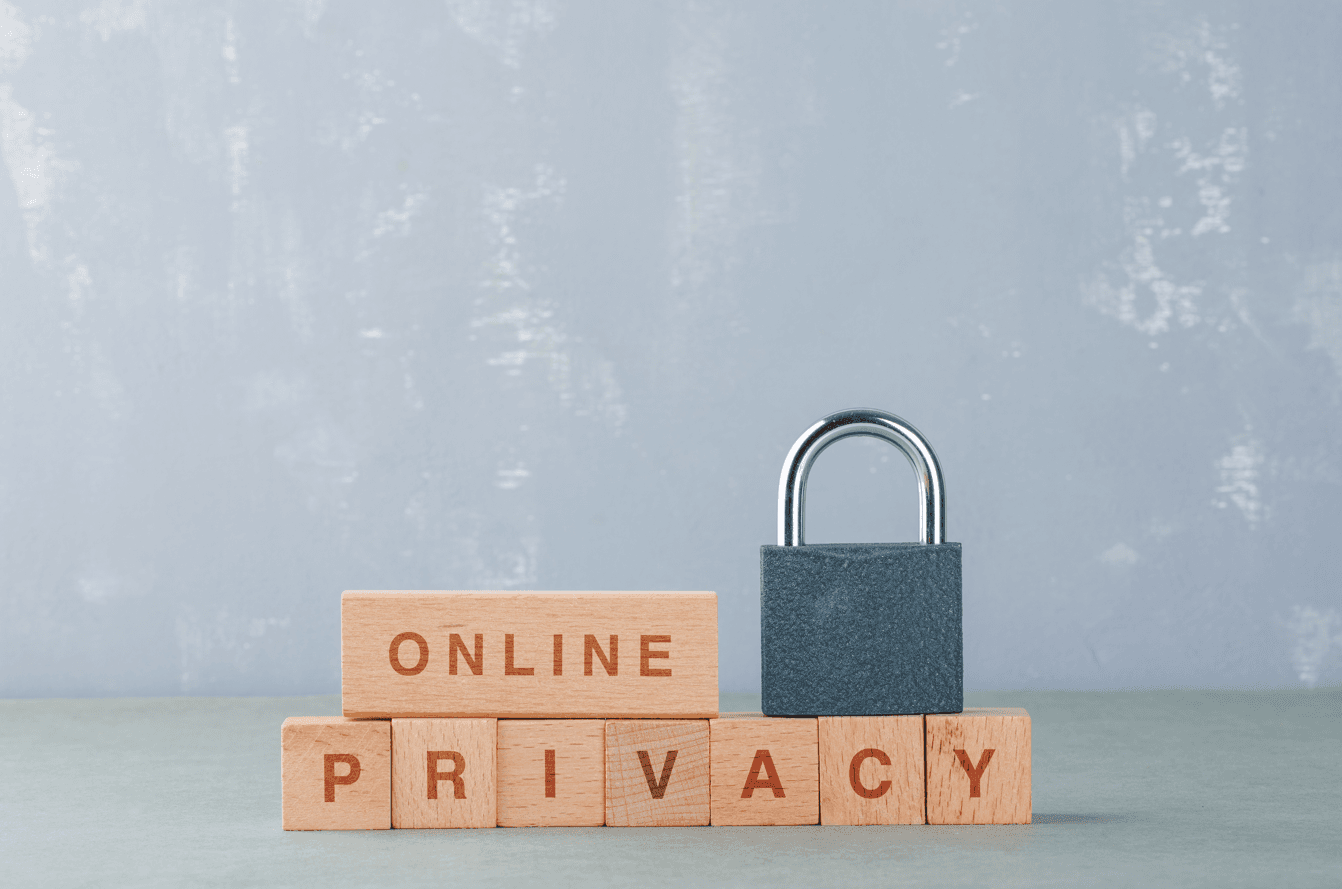 Data privacy concept with wooden blocks with words, lock on it side view.