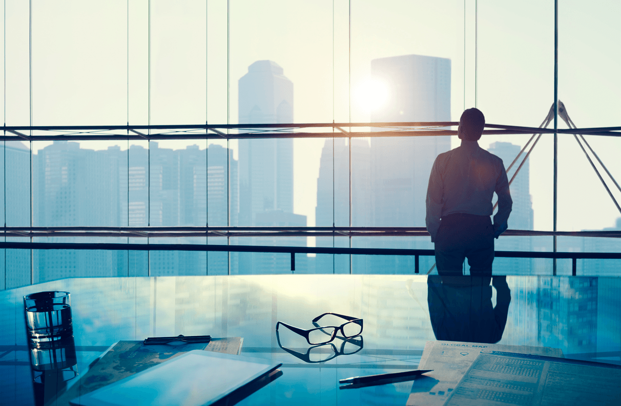 Picture shows an Investor in his big office
