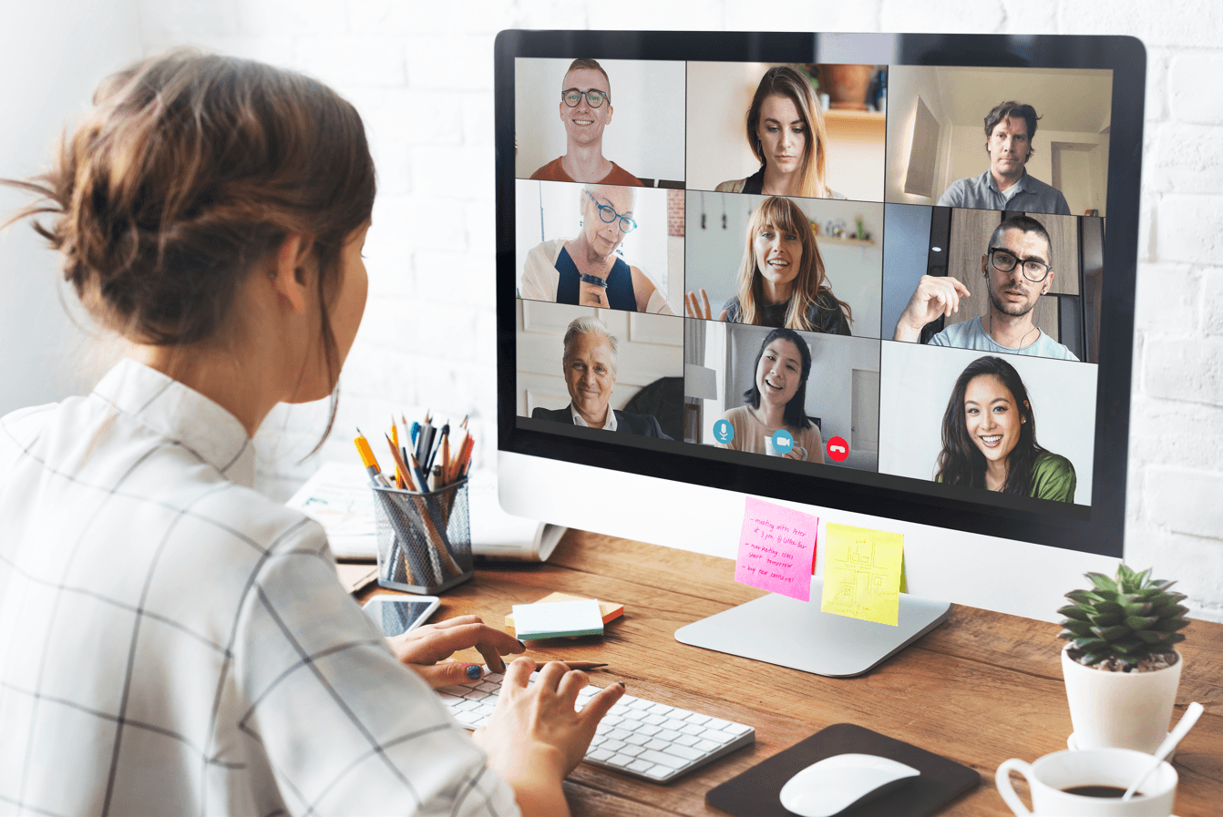 Woman in a video conference call in her home office.